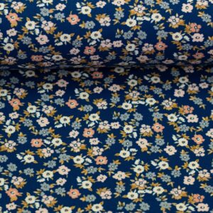 Bomuldsjersey små hvide og lyserøde blomster på blå